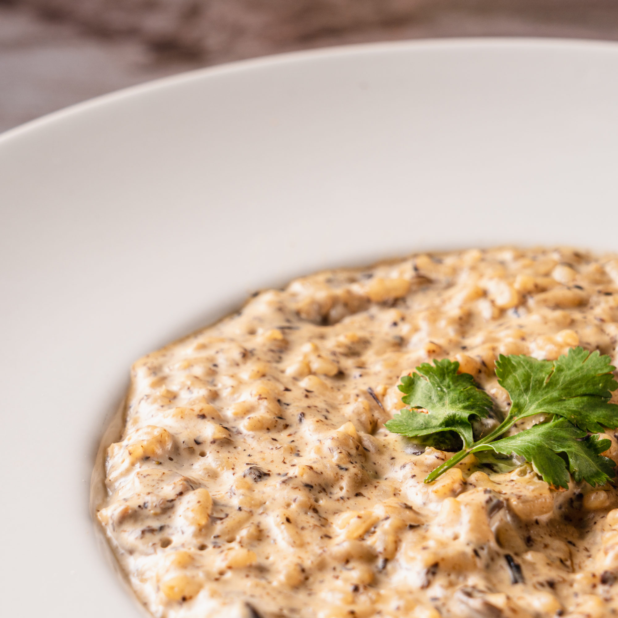 Delicious mushroom risotto on a wooden table