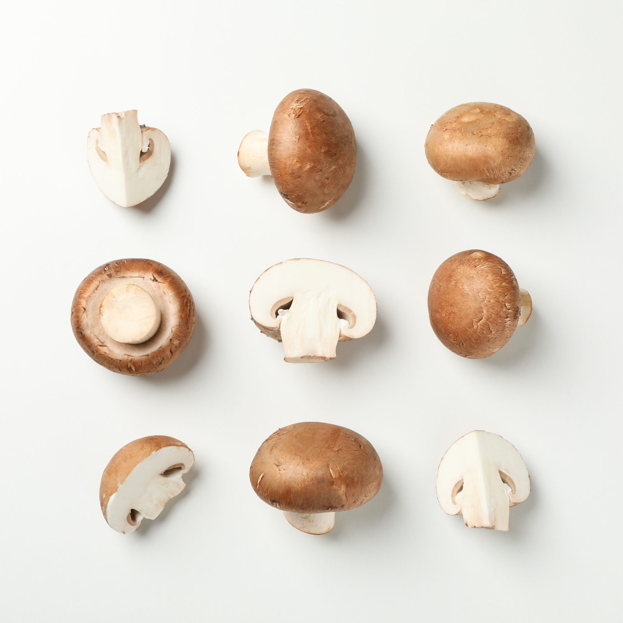 Flat lay with champignon mushrooms on white background, space fo